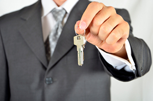 Businessman holding key